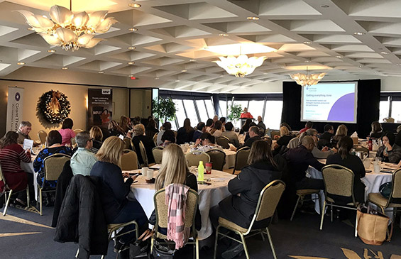 A room filled with participants of the a previous AFOA Atlantic Fall Conference. They are sitting in their seats, enjoying one of our sessions.